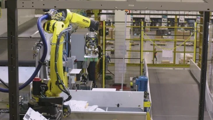 Image showing robot arm from Amazon Warehouse.